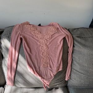 Long sleeve body suit.